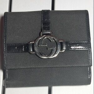 Black vintage cloth and leather Gucci bifold wallet.